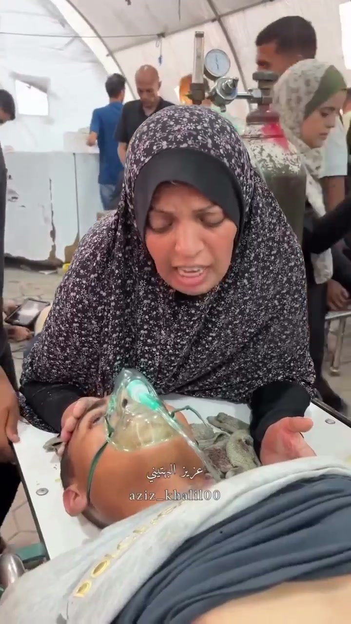 Mother praying over injured boy